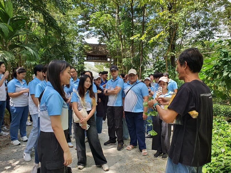 Young Executive students learn outside the classroom at the Maeb Uang Natural Farming Center.